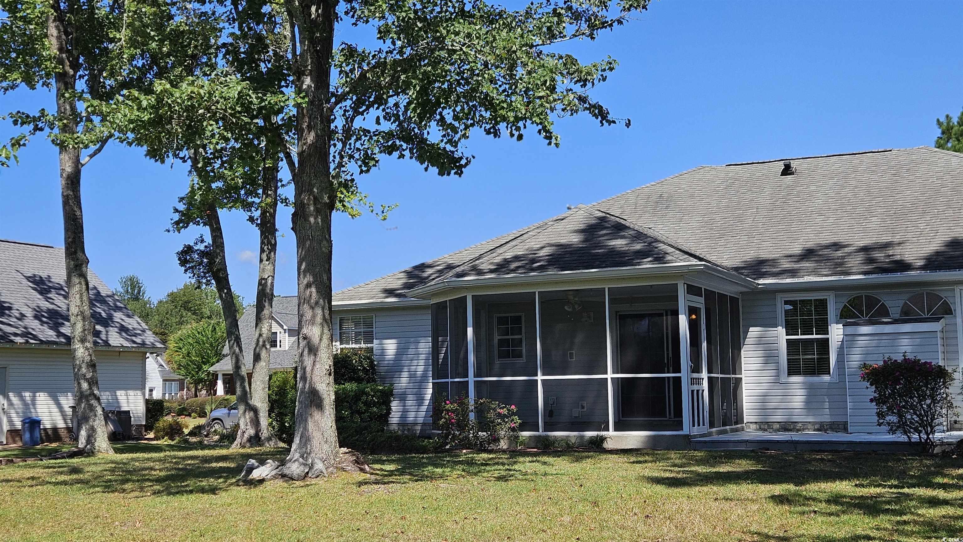 545 Saluda River Road Myrtle Beach, SC 29588 - Photo 24 of 25 Big lawn, a sunroom, and Patio