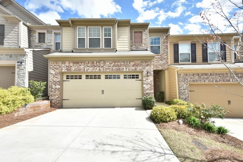 Impressive townhouse with two car garage.