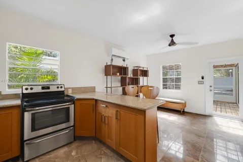 a kitchen with stainless steel appliances granite countertop a stove and a sink