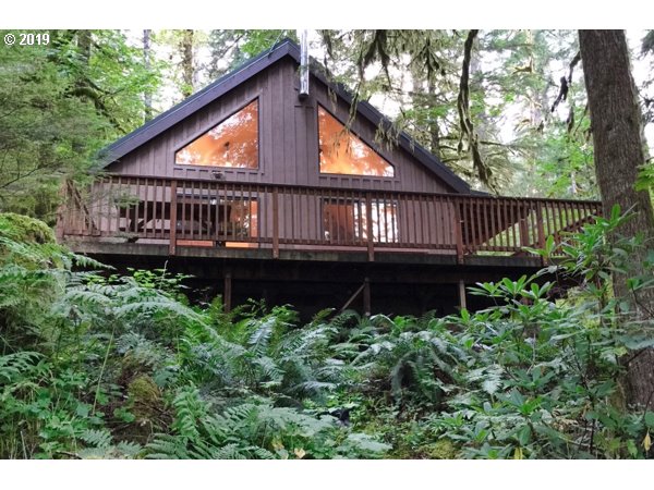 28260 Road 12, Unit LOT35 Rhododendron, OR 97049 - Photo 1 of 30 a view of a house with wooden deck and furniture