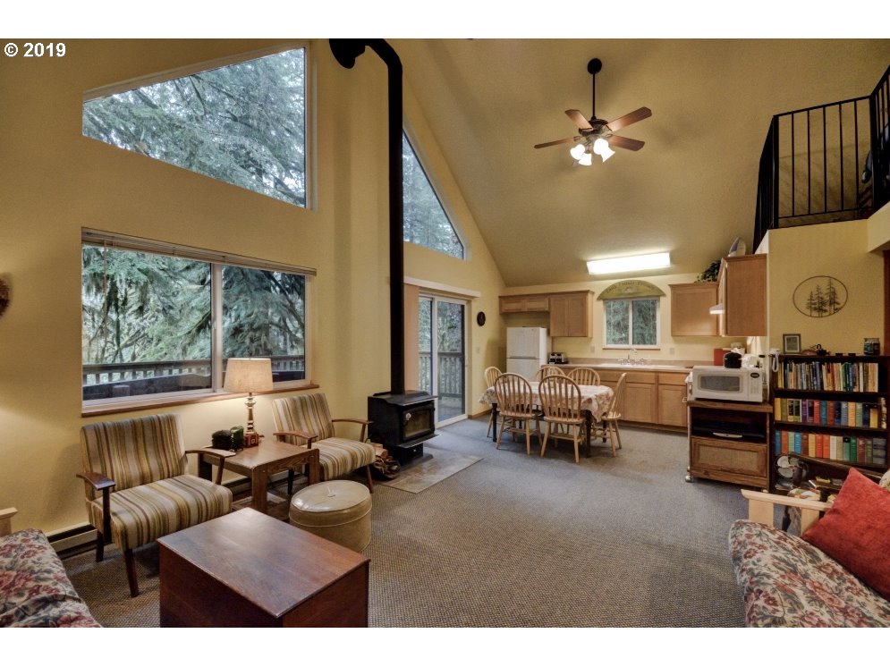 28260 Road 12, Unit LOT35 Rhododendron, OR 97049 - Photo 6 of 30 a living room with furniture and a large window