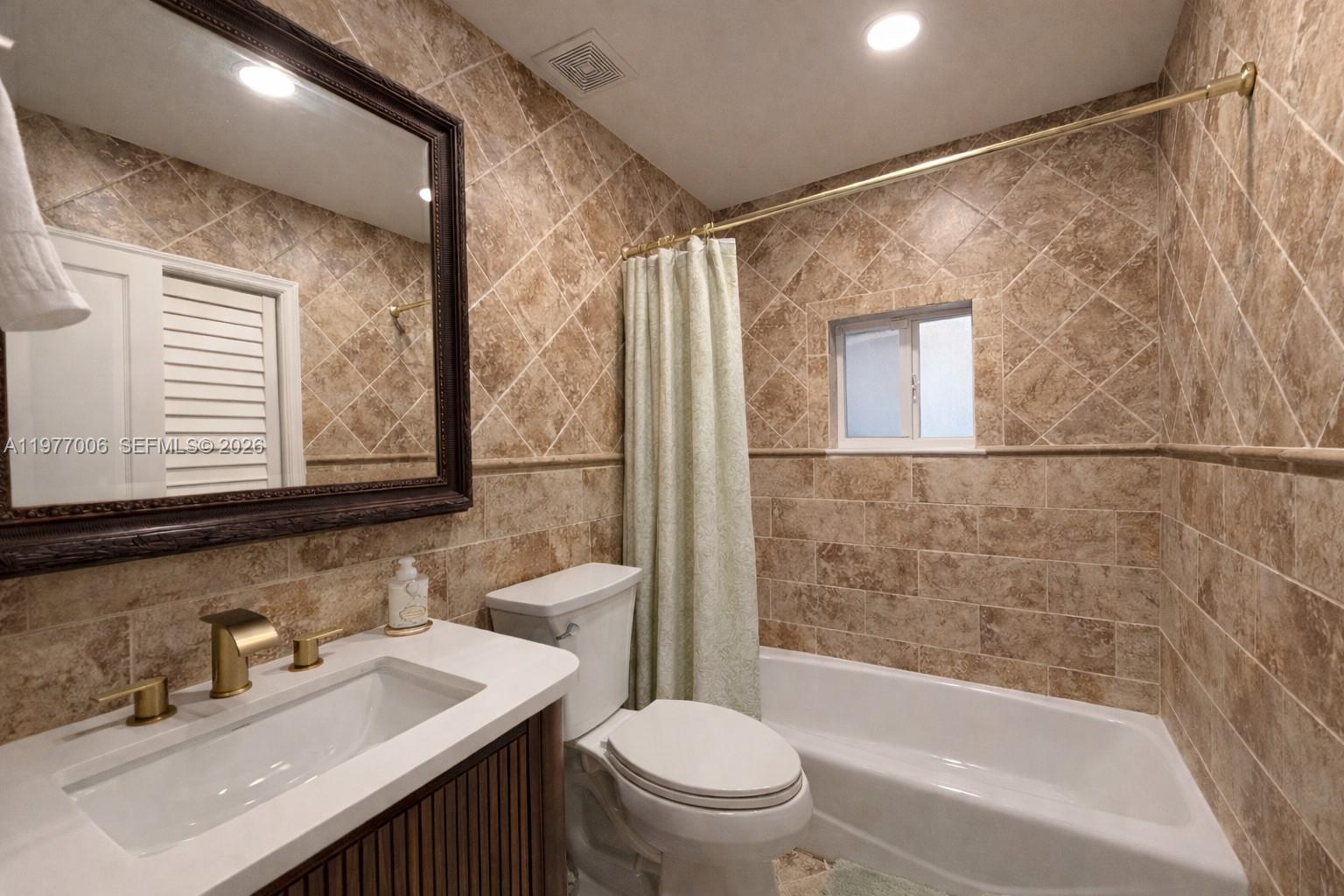 12901 Southwest 191st Street Miami, FL 33177 - Photo 11 of 27 a bathroom with a sink toilet and shower