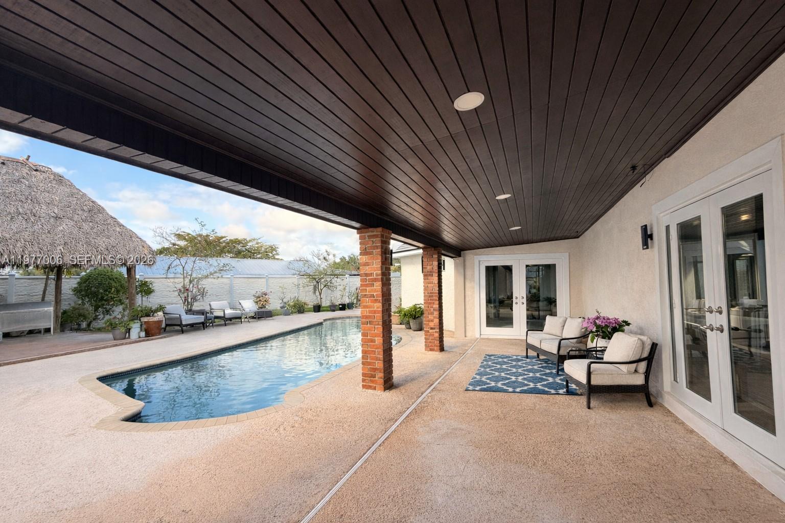 12901 Southwest 191st Street Miami, FL 33177 - Photo 16 of 27 a living room with stainless steel appliances granite countertop furniture and fireplace