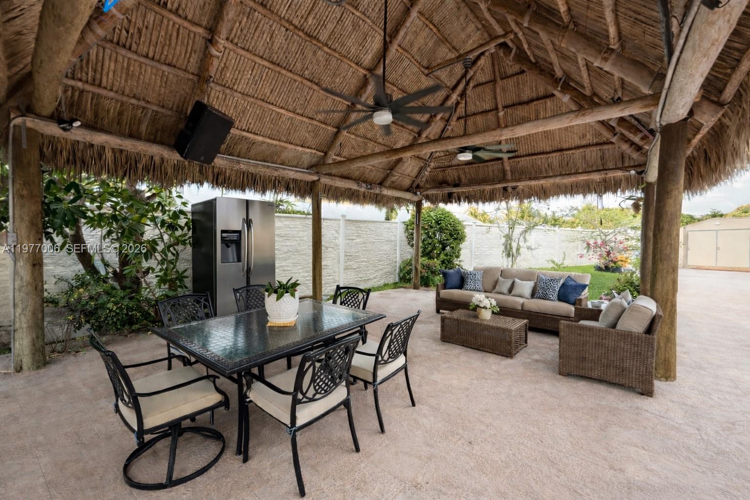 12901 Southwest 191st Street Miami, FL 33177 - Photo 17 of 27 a dining room with furniture and outdoor space