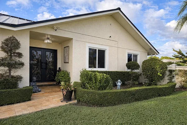 a front view of a house with garden