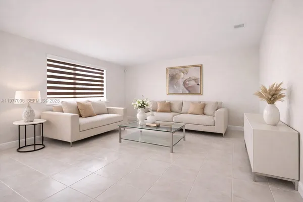 a living room with furniture and a large window