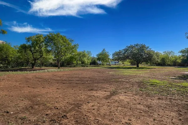 a view of outdoor space with deck and yard