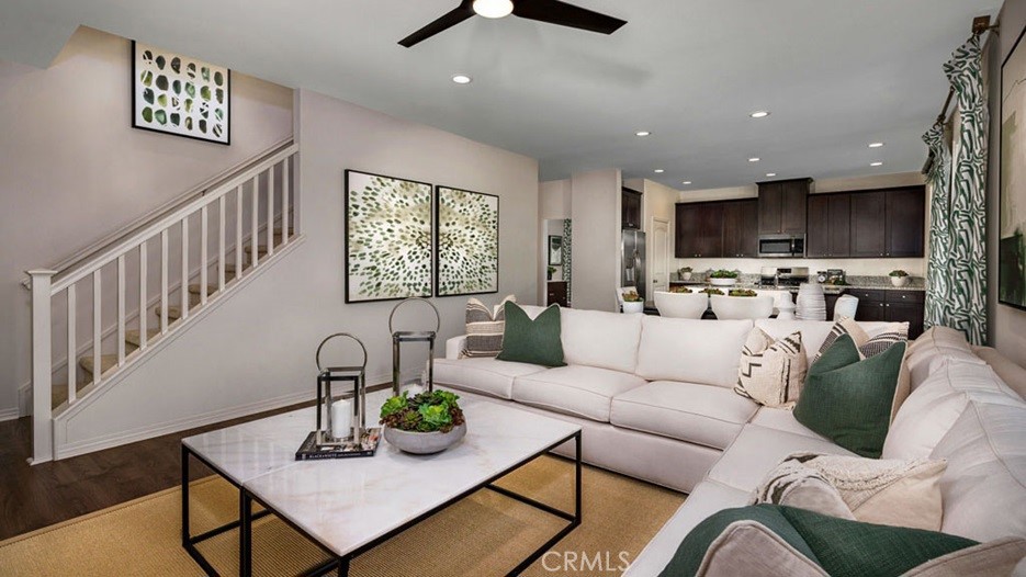 14068 Hera Place Beaumont, CA 92223 - Photo 14 of 14 a living room with furniture and a flat screen tv