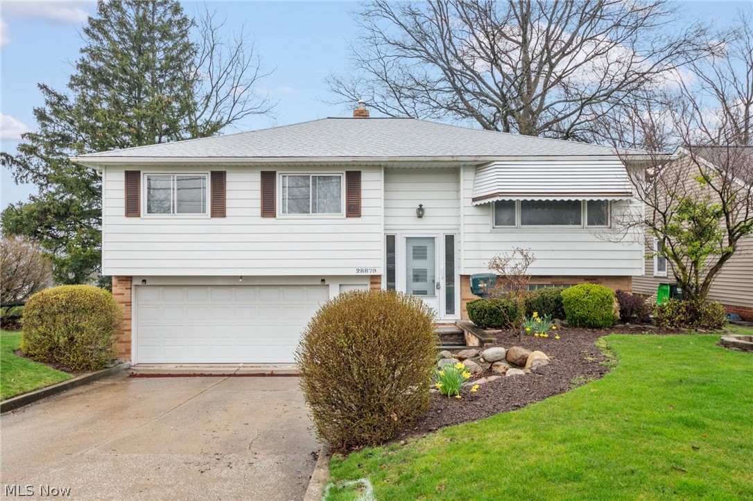 28879 Ridge Road Wickliffe, OH 44092 - Photo 1 of 34 Raised ranch featuring a front yard and a garage