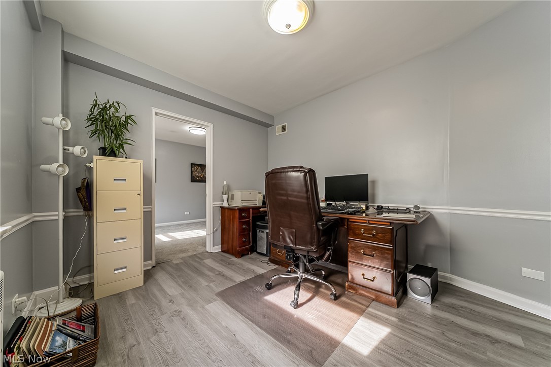 13800 Fairhill Road, Unit 306 Cleveland, OH 44120 - Photo 29 of 48 Office/bonus room with built-ins and its own separate access, offering flexible use as a private workspace, guest area, or potential 4th bedroom.