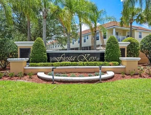 a view of a house with a yard and table and chairs