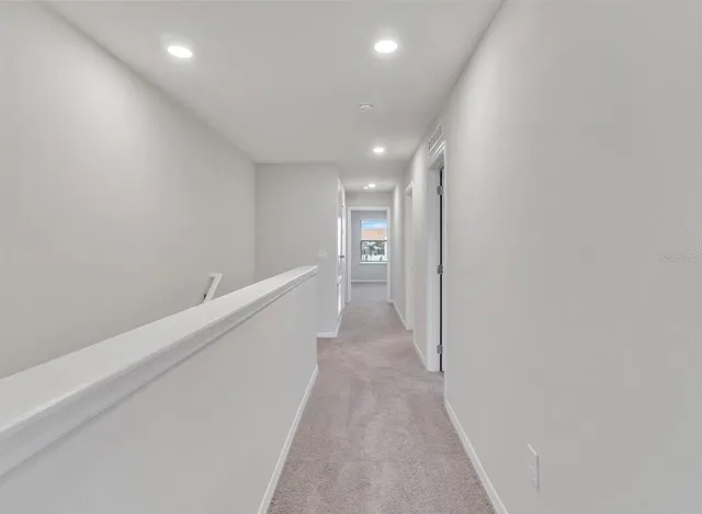 a view of hallway with stairs