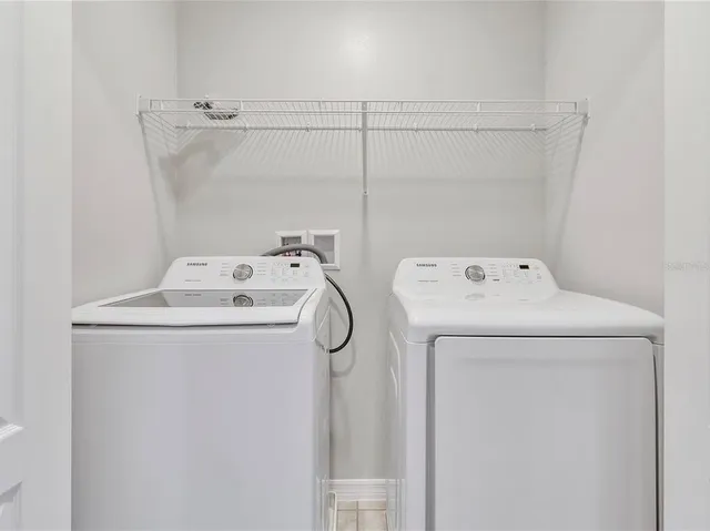 a utility room with dryer and washer
