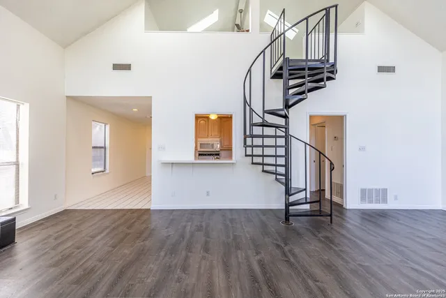 a view of entryway with wooden floor