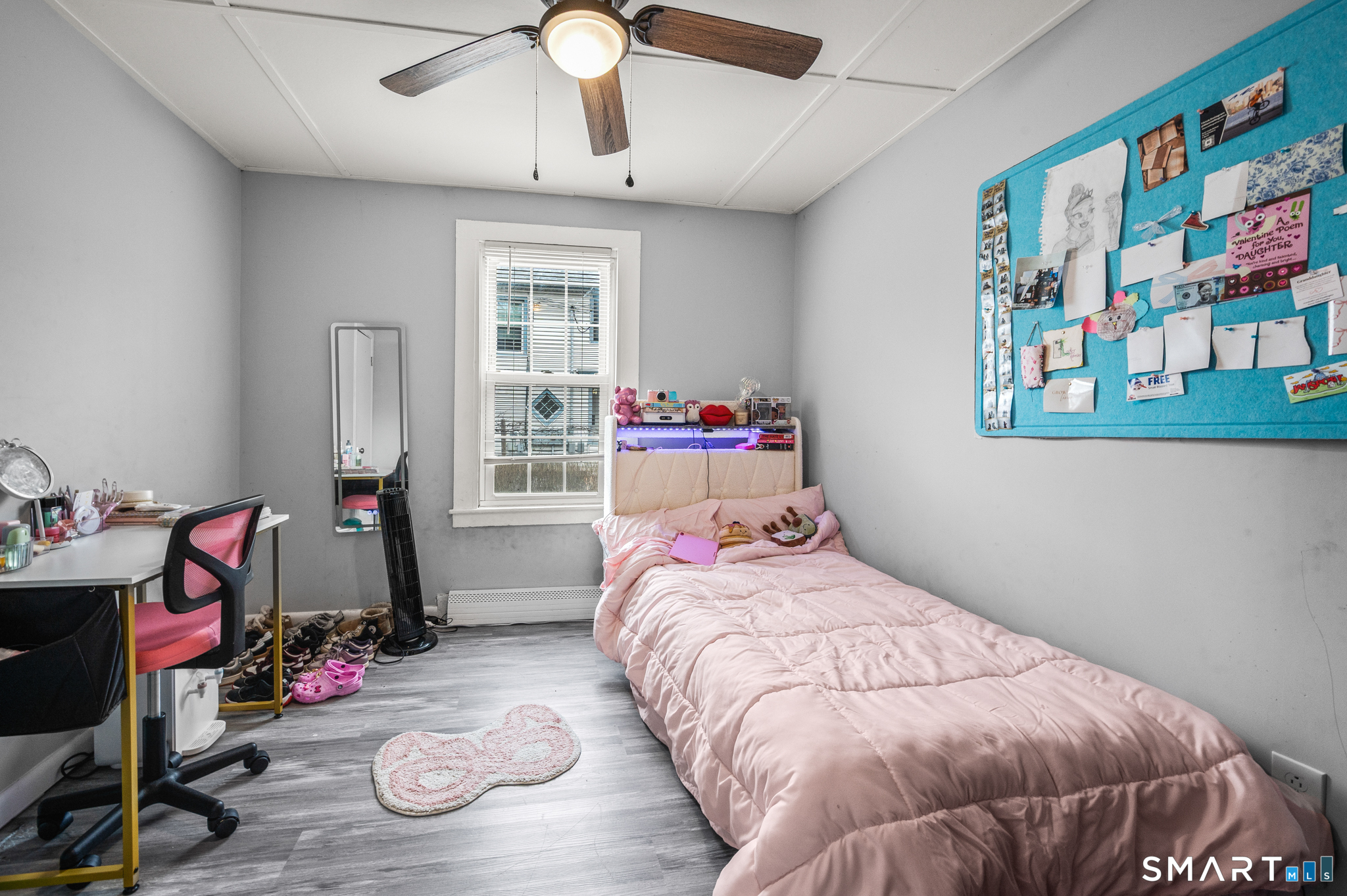 86 Bristol Street Southington, CT 06489 - Photo 8 of 19 a bedroom with a bed and wooden floor