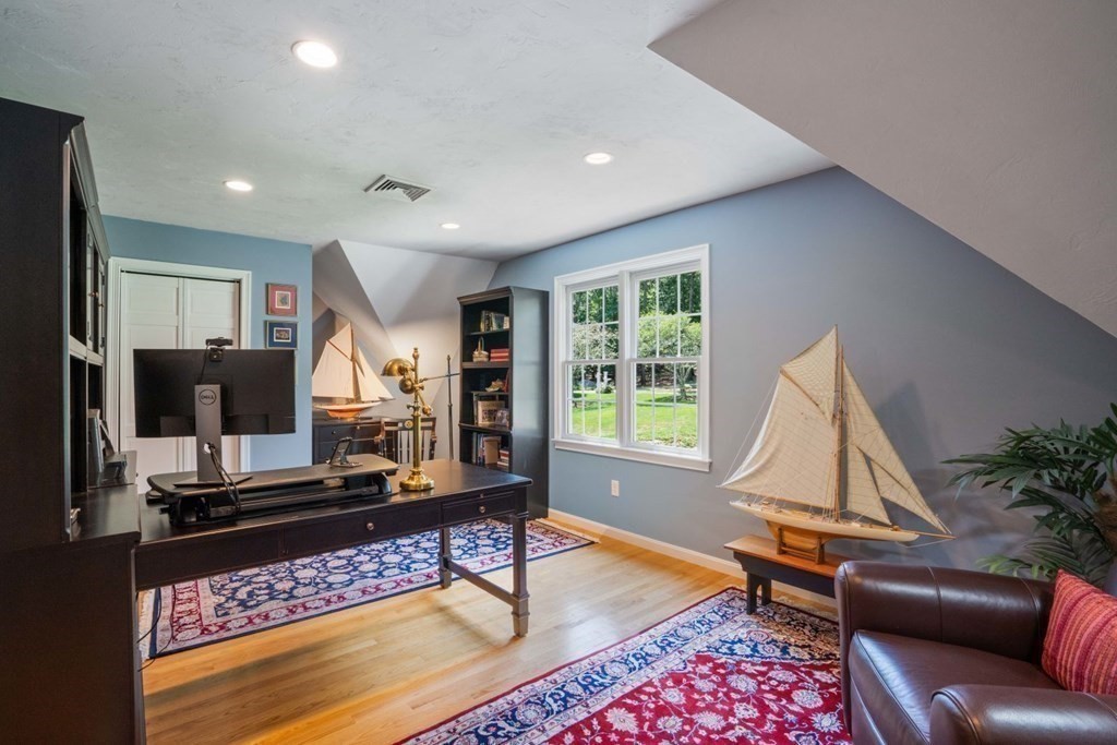 22 Falcon Ridge Drive Hopkinton, MA 01748 - Photo 19 of 42 a living room with furniture and a flat screen tv