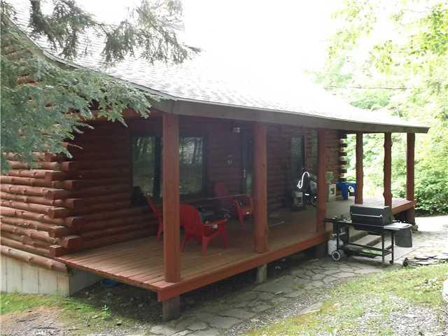 a backyard of a house with outdoor seating