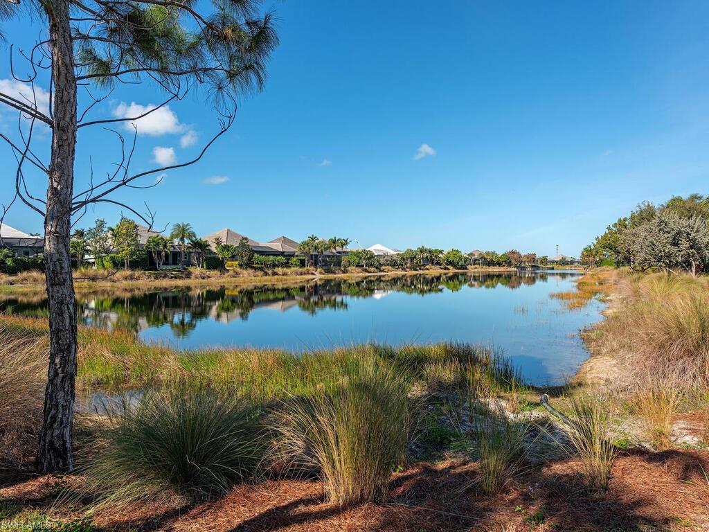 6399 Warwick Avenue Naples, FL 34113 - Photo 15 of 30 a view of lake and houses with outdoor space