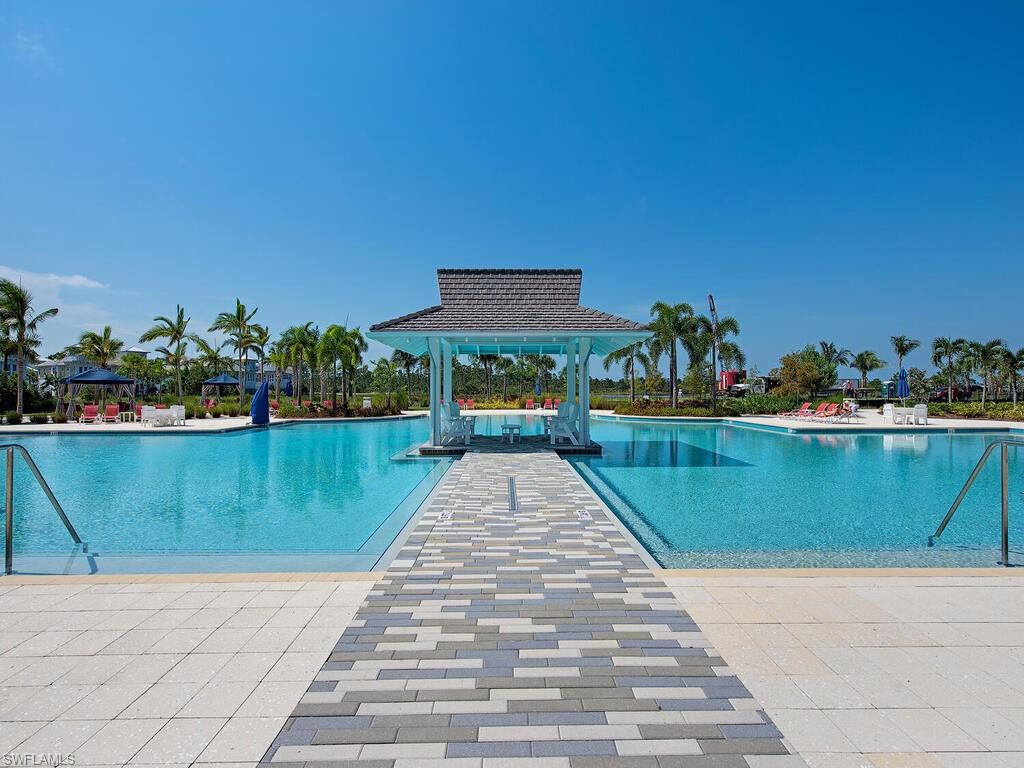6399 Warwick Avenue Naples, FL 34113 - Photo 21 of 30 a view of swimming pool with a lake view
