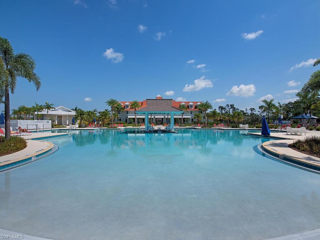 6399 Warwick Avenue Naples, FL 34113 - Photo 22 of 30 a view of swimming pool with outdoor seating and yard