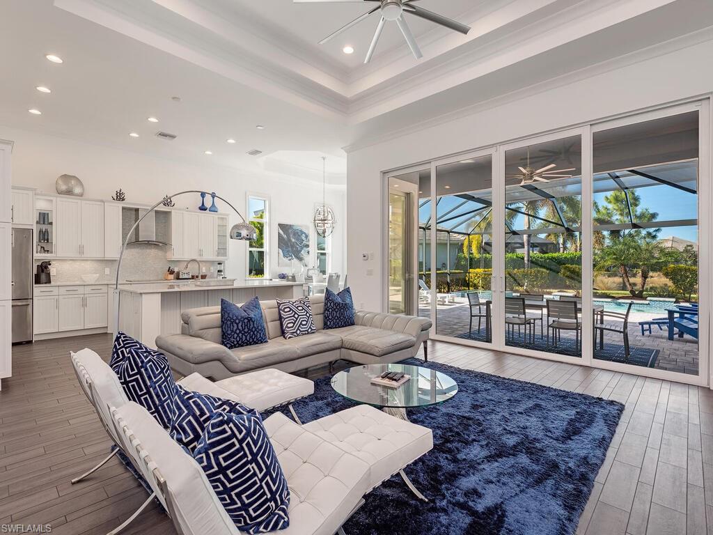 6399 Warwick Avenue Naples, FL 34113 - Photo 4 of 30 a living room with furniture and a large window