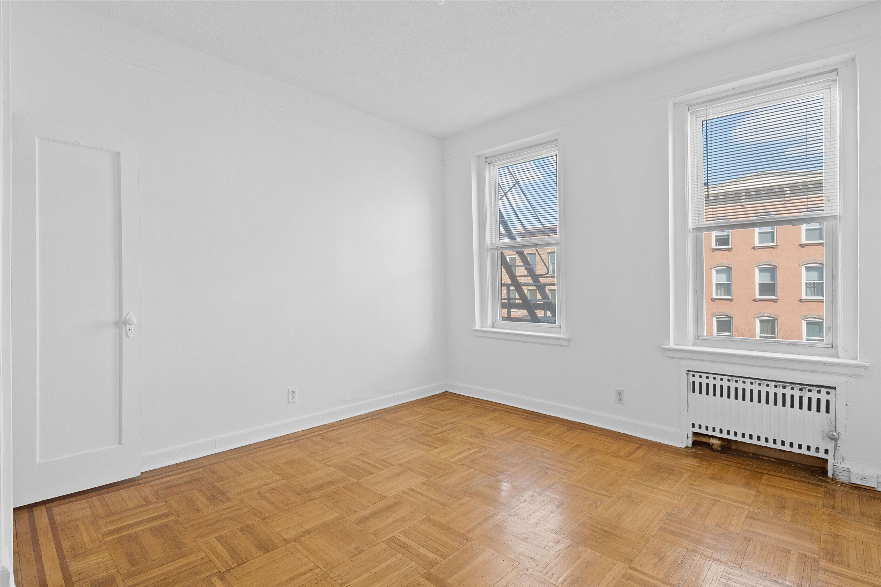 410 Washington Street, Unit 5 Hoboken, NJ 07030 - Photo 12 of 15 a view of an empty room with a window