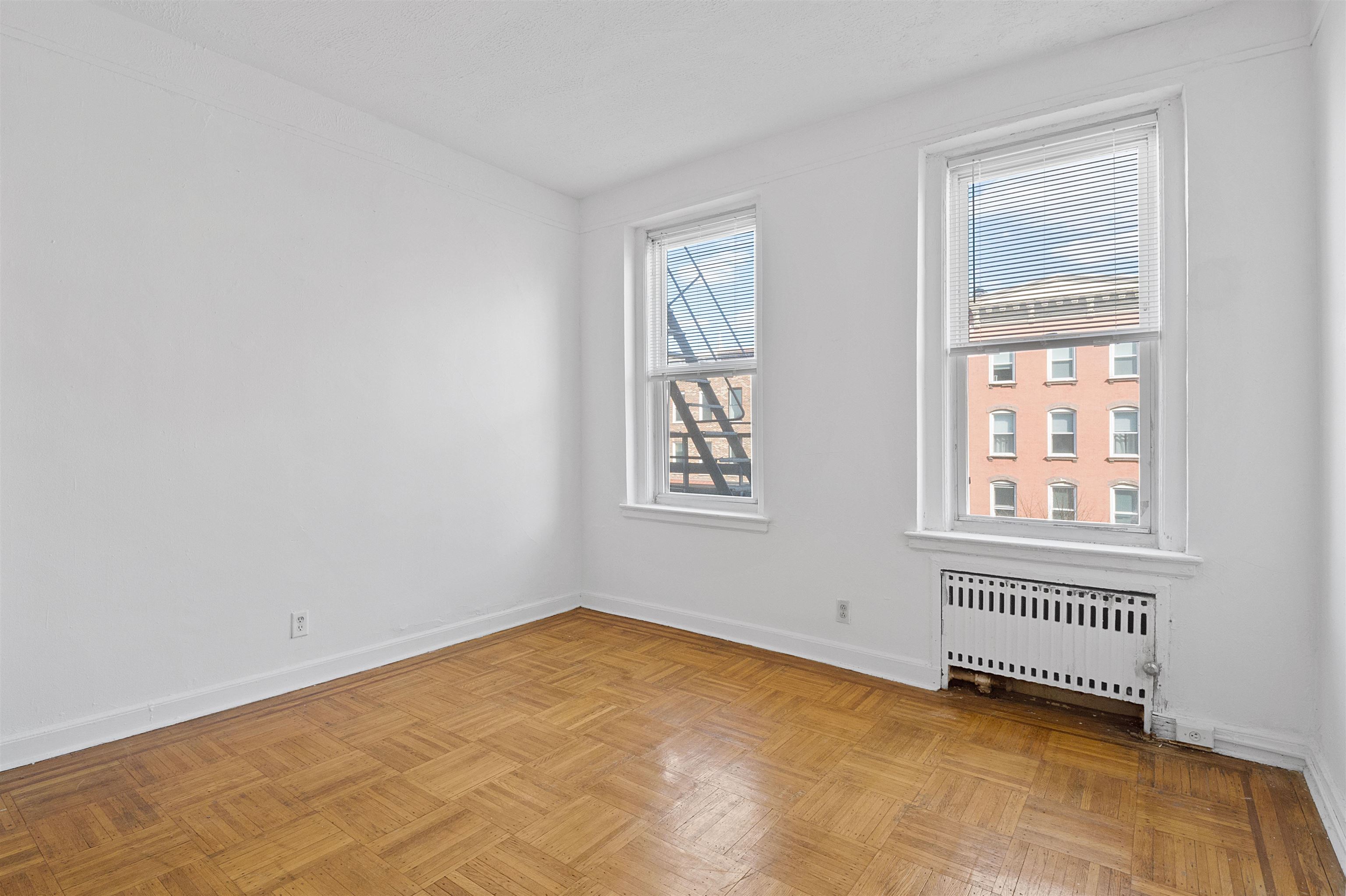 410 Washington Street, Unit 5 Hoboken, NJ 07030 - Photo 8 of 15 a view of an empty room with a window