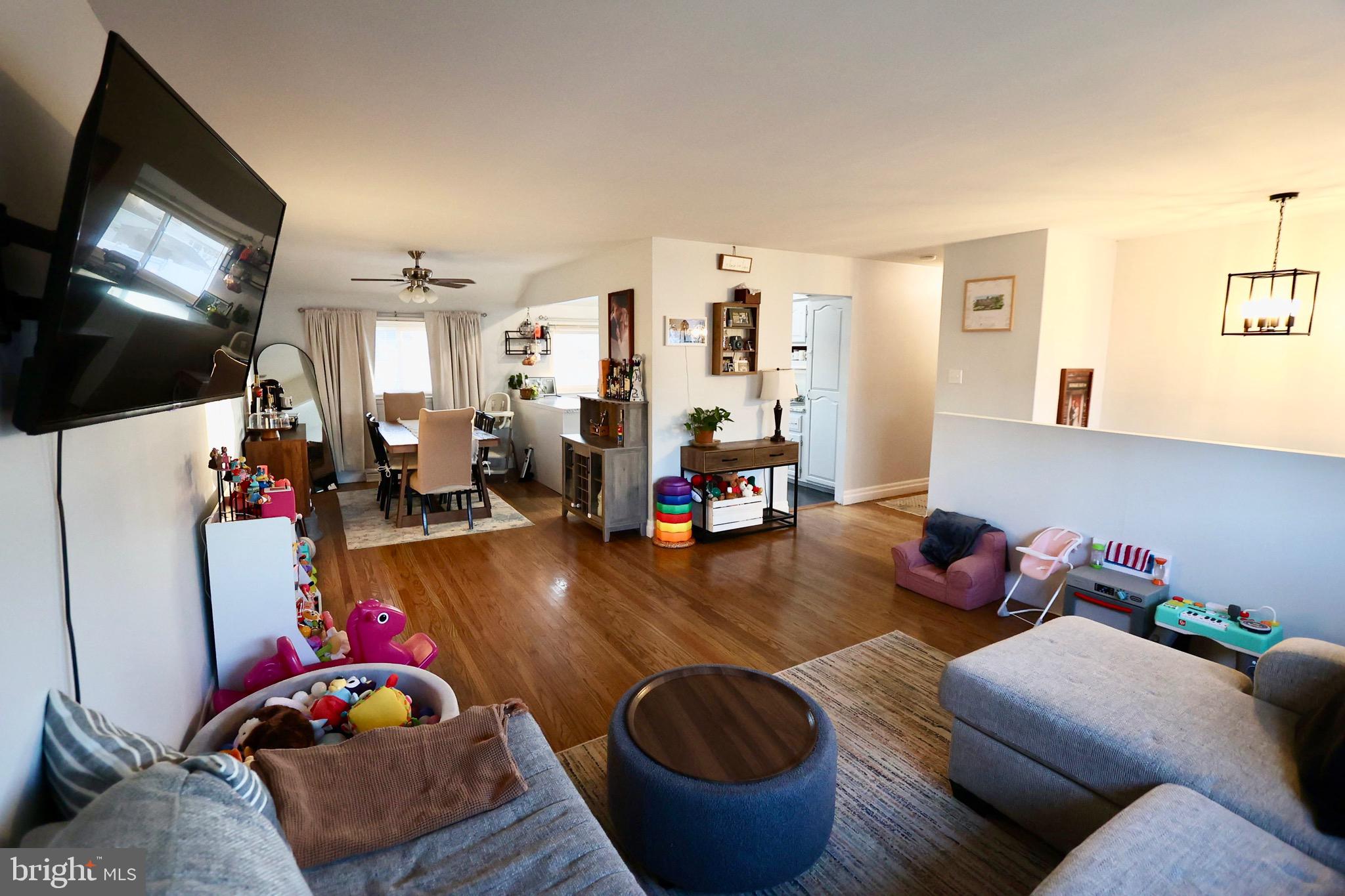 1036 Surrey Road Somerdale, NJ 08083 - Photo 6 of 23 a living room with furniture and a flat screen tv