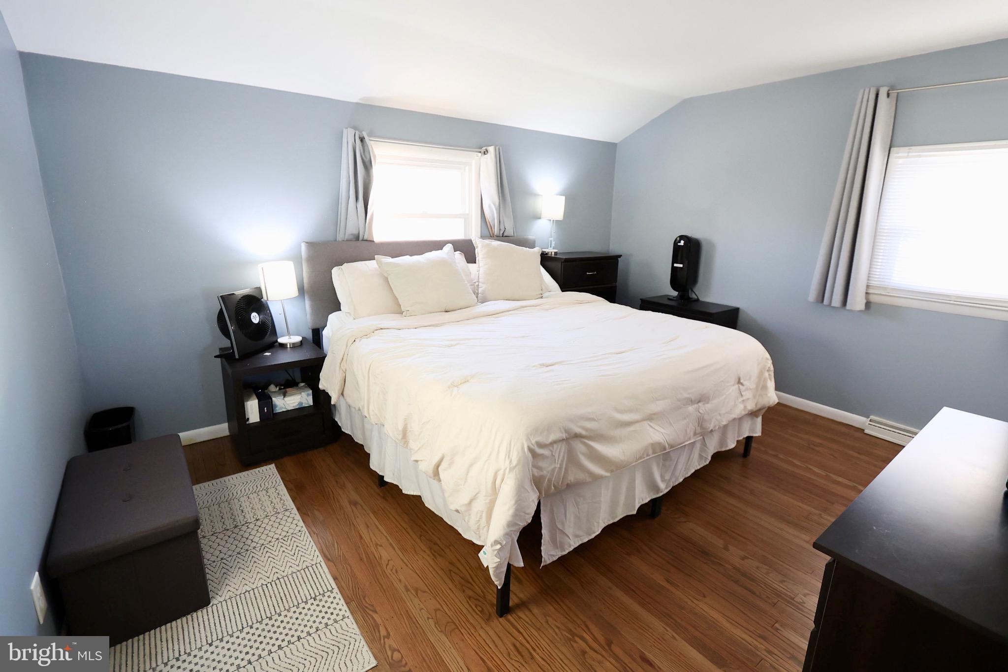 1036 Surrey Road Somerdale, NJ 08083 - Photo 9 of 23 a bedroom with bed and a window