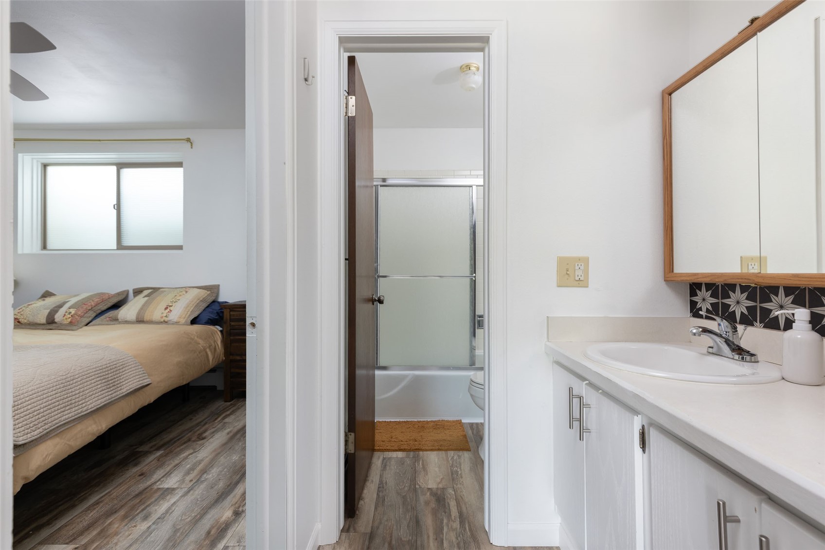 180 Evergreen Road, Unit 105 Dillon, CO 80435 - Photo 12 of 24 a en suite bathroom with a sink and a mirror