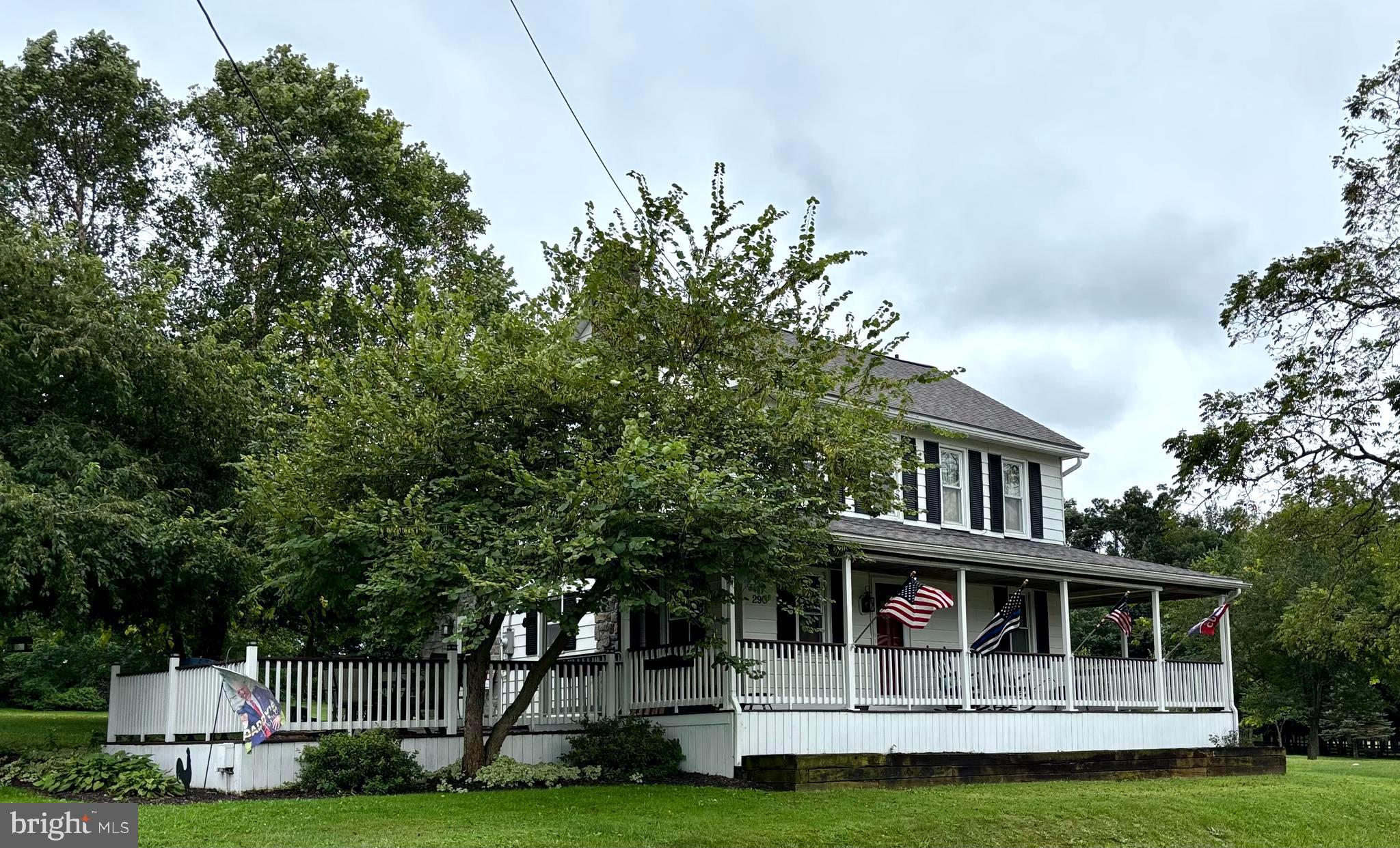 290 Woods Road Abbottstown, PA 17301 - Photo 2 of 49 a front view of a house with a garden