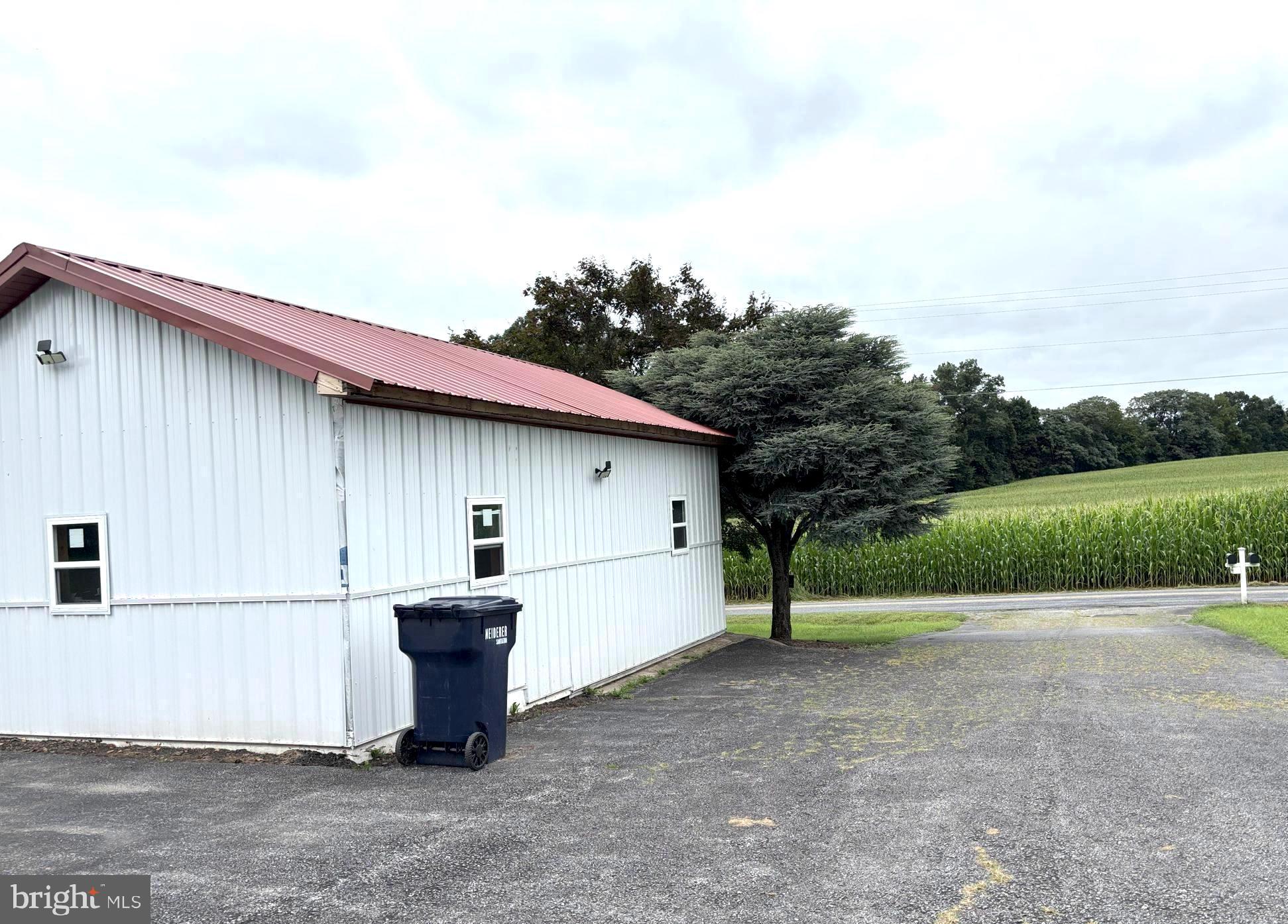 290 Woods Road Abbottstown, PA 17301 - Photo 32 of 49 a backyard of a house with barbeque oven and yard