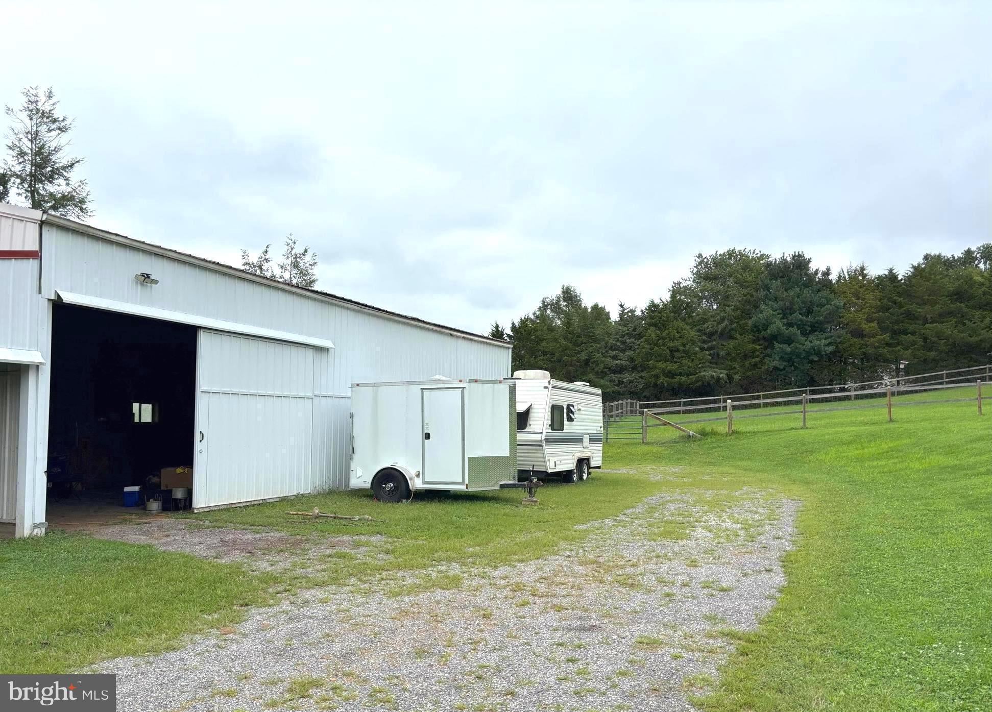 290 Woods Road Abbottstown, PA 17301 - Photo 38 of 49 a view of a backyard with flat screen tv