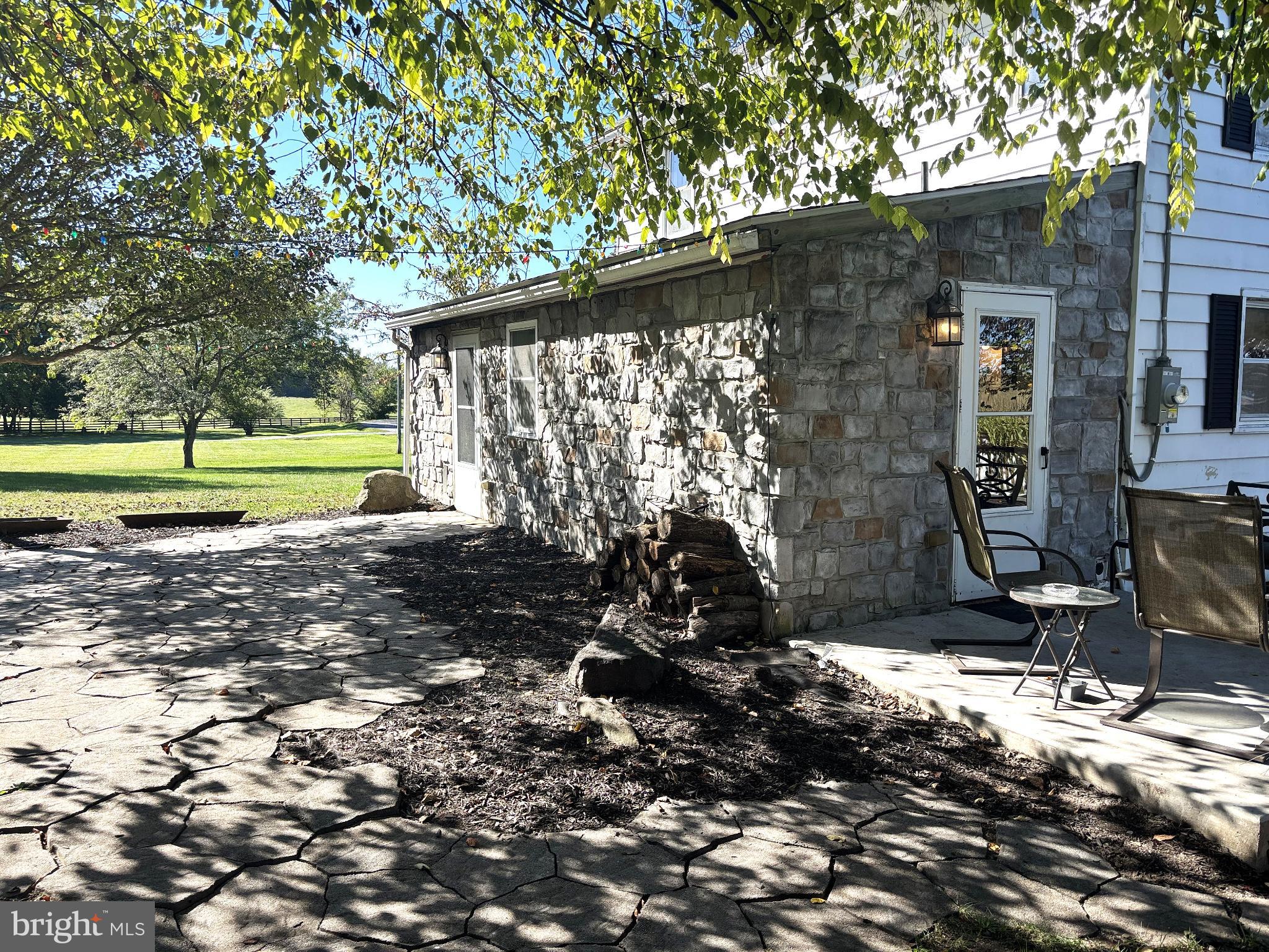 290 Woods Road Abbottstown, PA 17301 - Photo 6 of 49 a view of a house with backyard and sitting area
