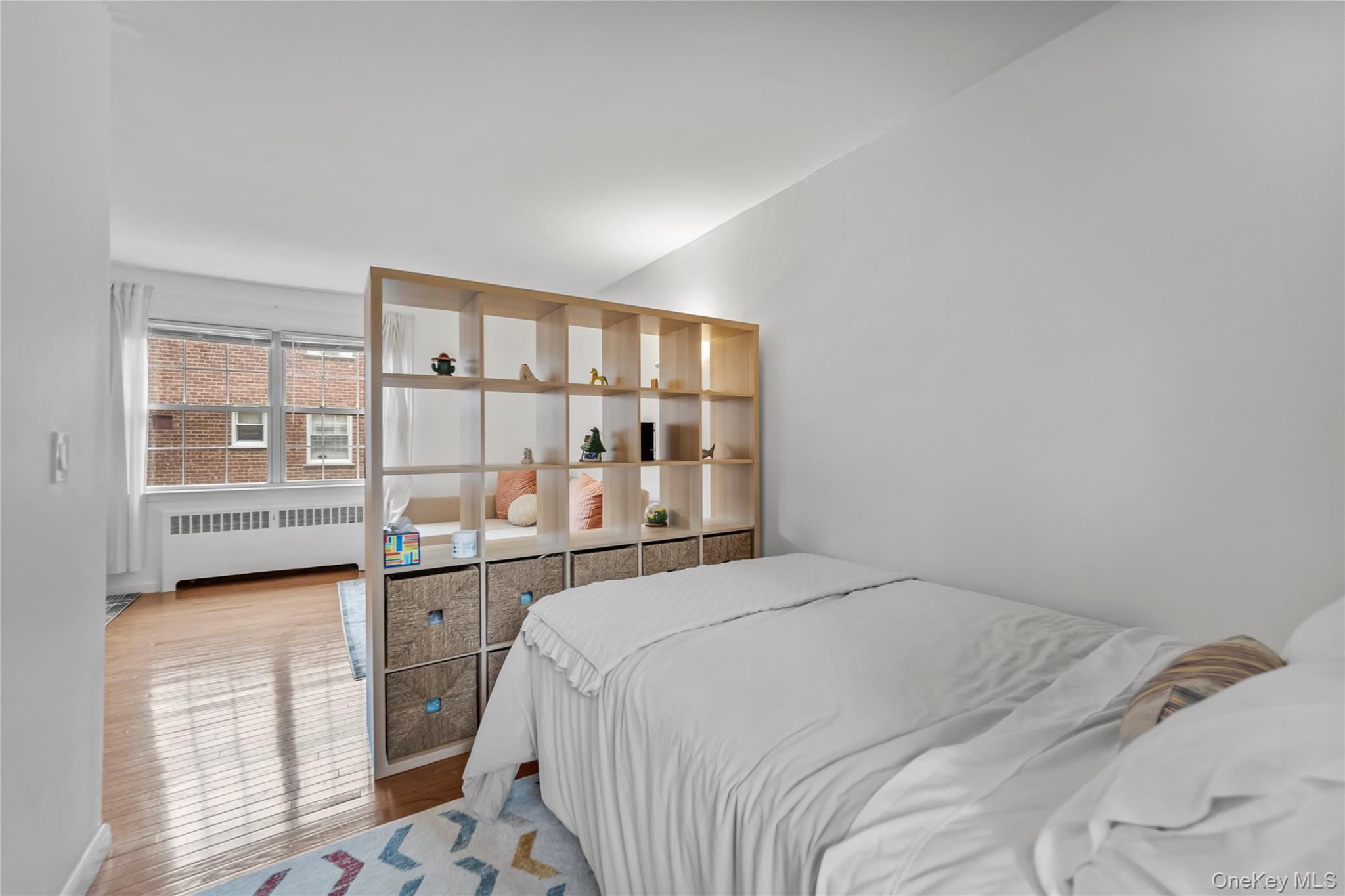 182 Pinewood Road, Unit 23 Hartsdale, NY 10530 - Photo 11 of 16 a bedroom with a large bed and a window