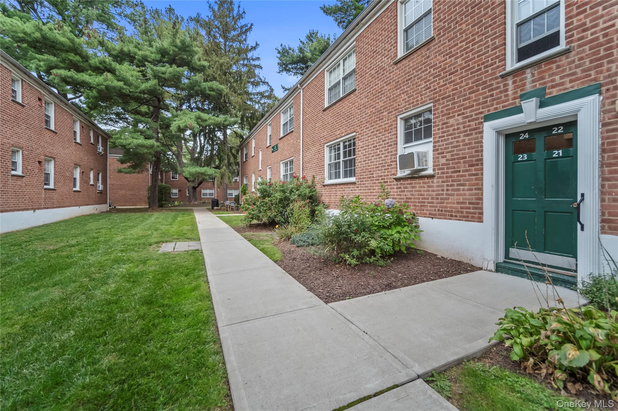 182 Pinewood Road, Unit 23 Hartsdale, NY 10530 - Photo 15 of 16 a view of a house with a yard