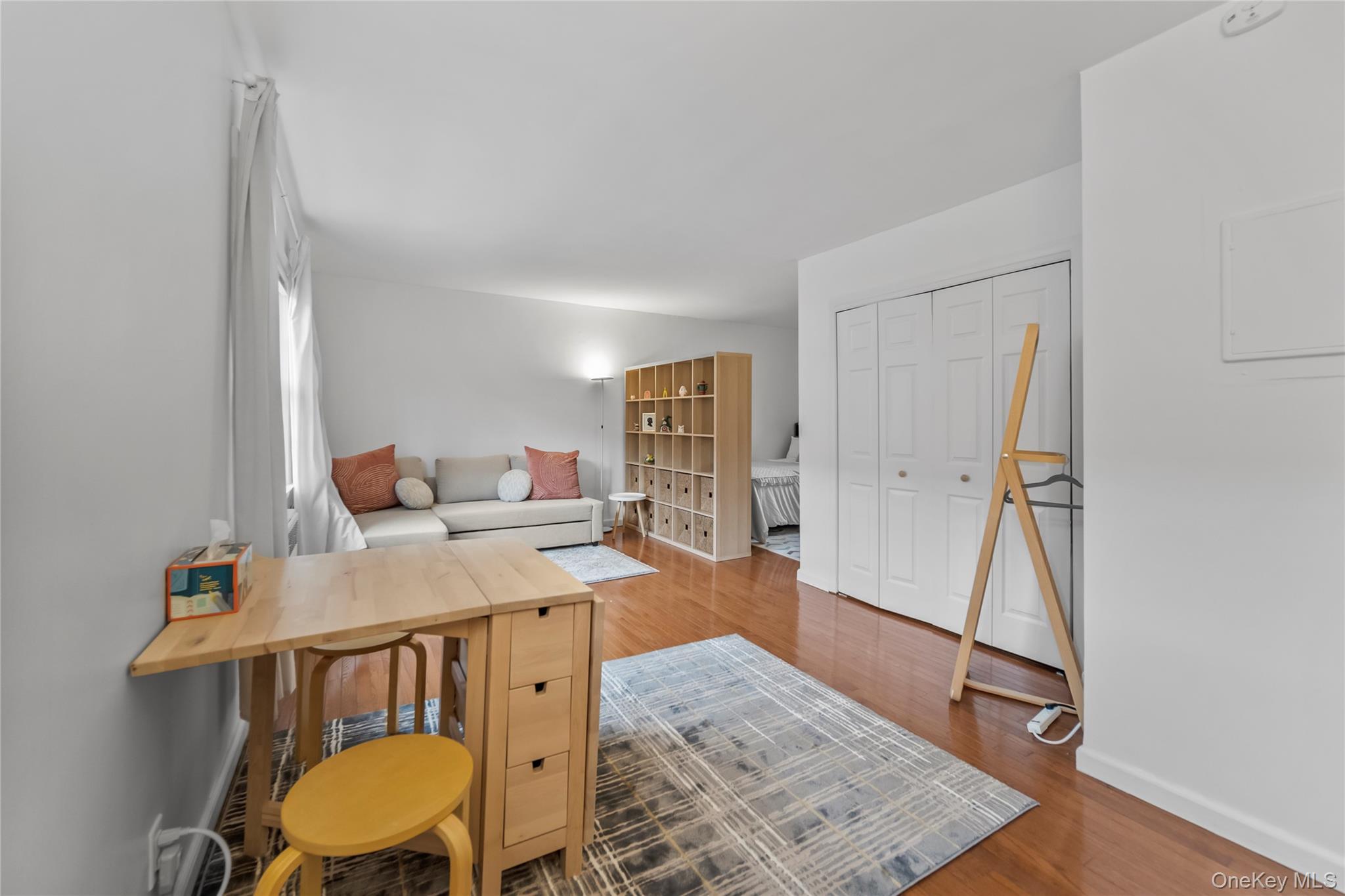 182 Pinewood Road, Unit 23 Hartsdale, NY 10530 - Photo 8 of 16 a view of a workspace with furniture and wooden floor