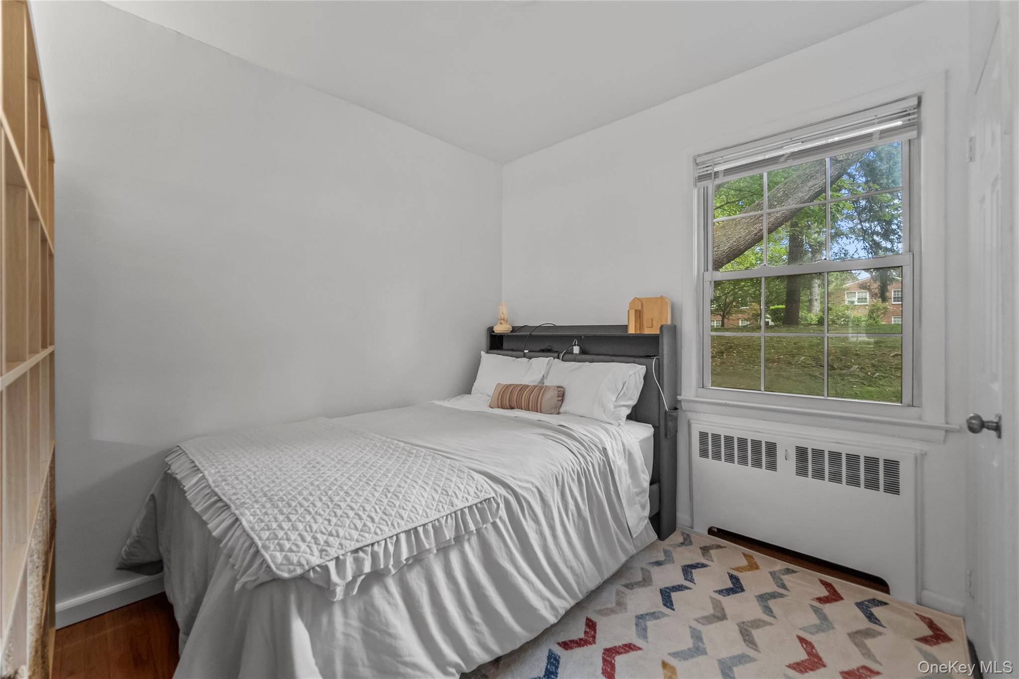 182 Pinewood Road, Unit 23 Hartsdale, NY 10530 - Photo 10 of 16 a bedroom with a bed and a window