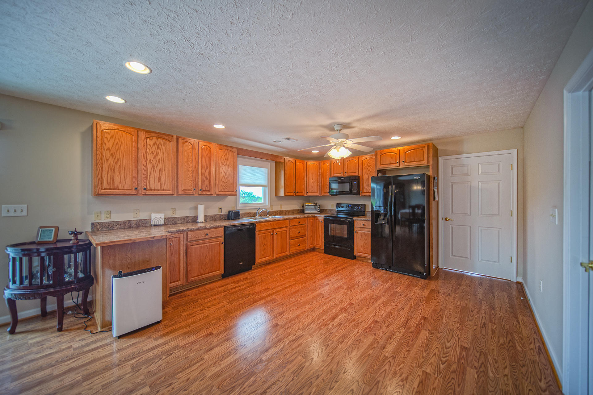 3746 Horseshoe Bend Road Goodview, VA 24095 - Photo 11 of 35 a large kitchen with lots of counter top space and stainless steel appliances