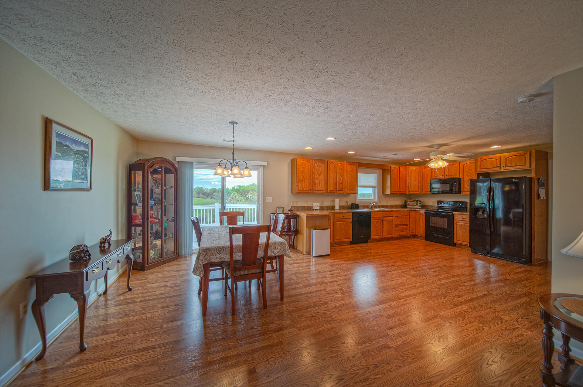 3746 Horseshoe Bend Road Goodview, VA 24095 - Photo 15 of 35 a living room with lots of furniture and kitchen view