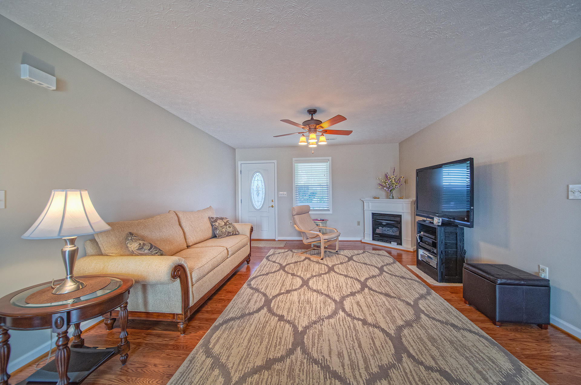 3746 Horseshoe Bend Road Goodview, VA 24095 - Photo 16 of 35 a living room with furniture and a flat screen tv