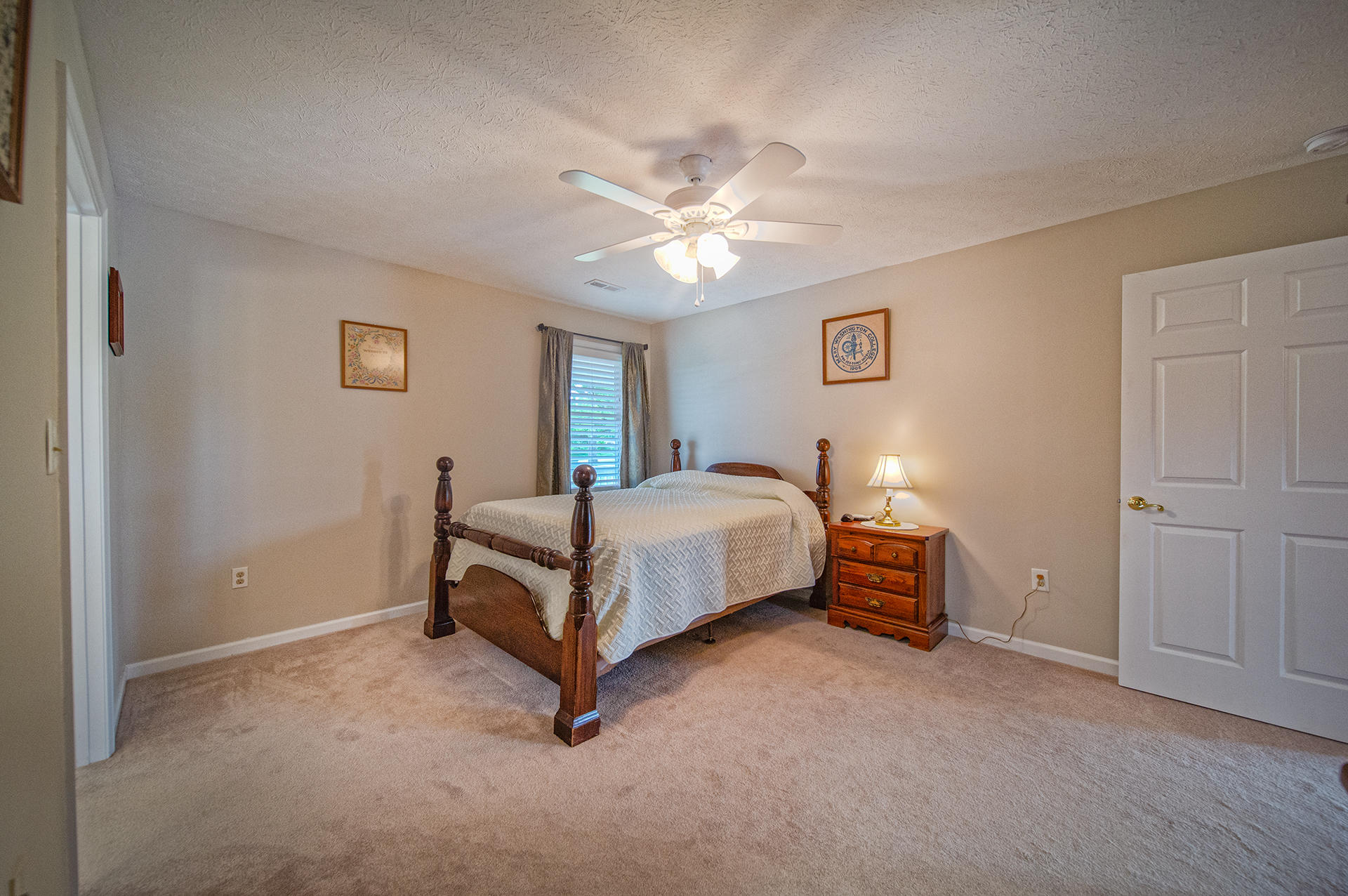 3746 Horseshoe Bend Road Goodview, VA 24095 - Photo 19 of 35 a bedroom with a bed and a chandelier