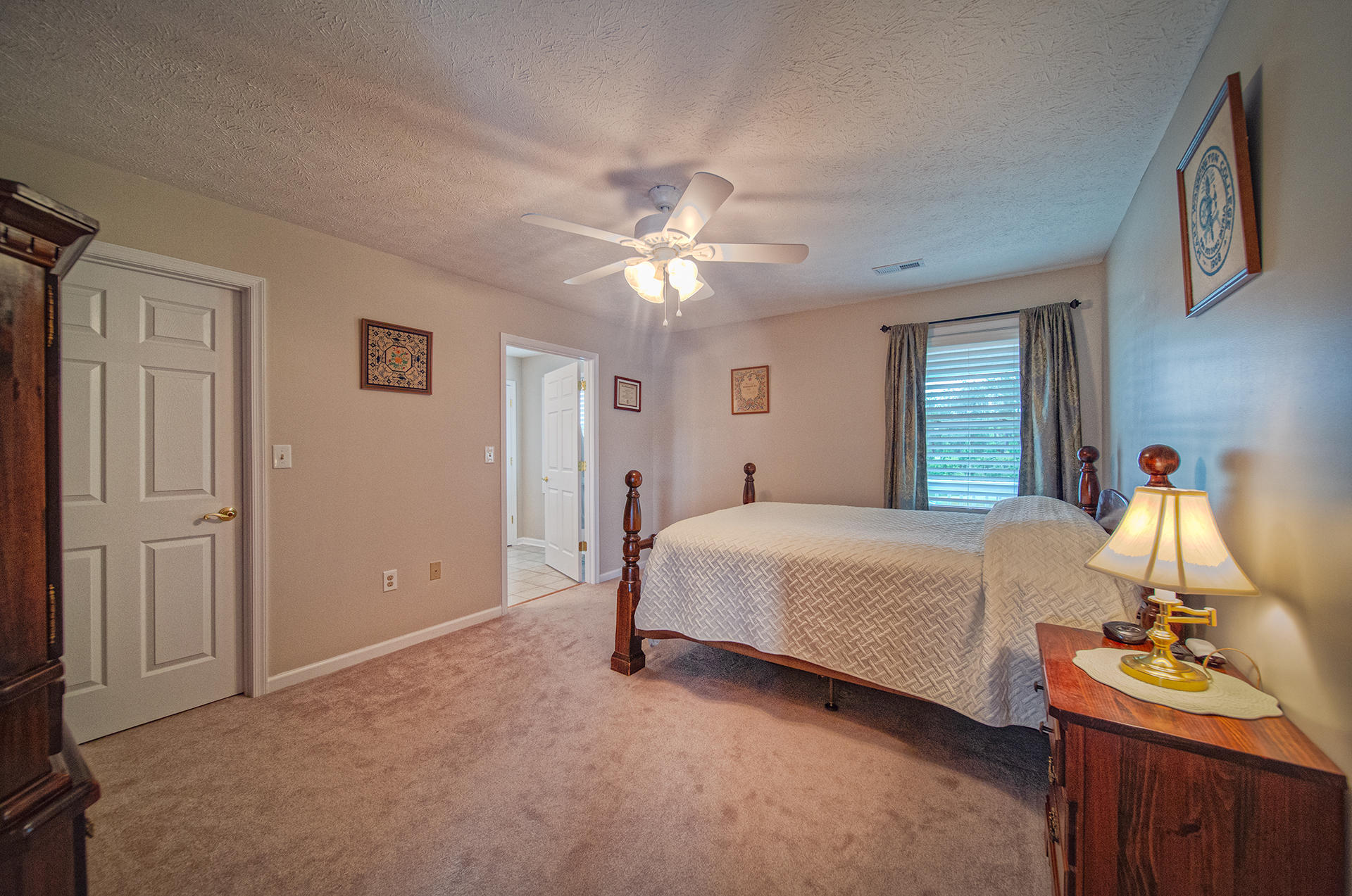 3746 Horseshoe Bend Road Goodview, VA 24095 - Photo 20 of 35 a bedroom with a bed and a chandelier