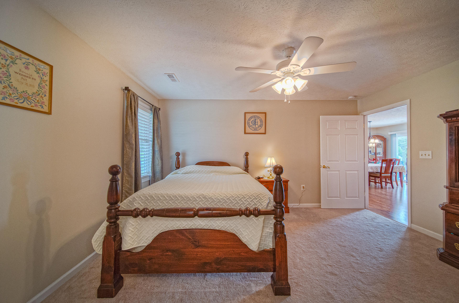 3746 Horseshoe Bend Road Goodview, VA 24095 - Photo 21 of 35 a bedroom with a bed and a chandelier