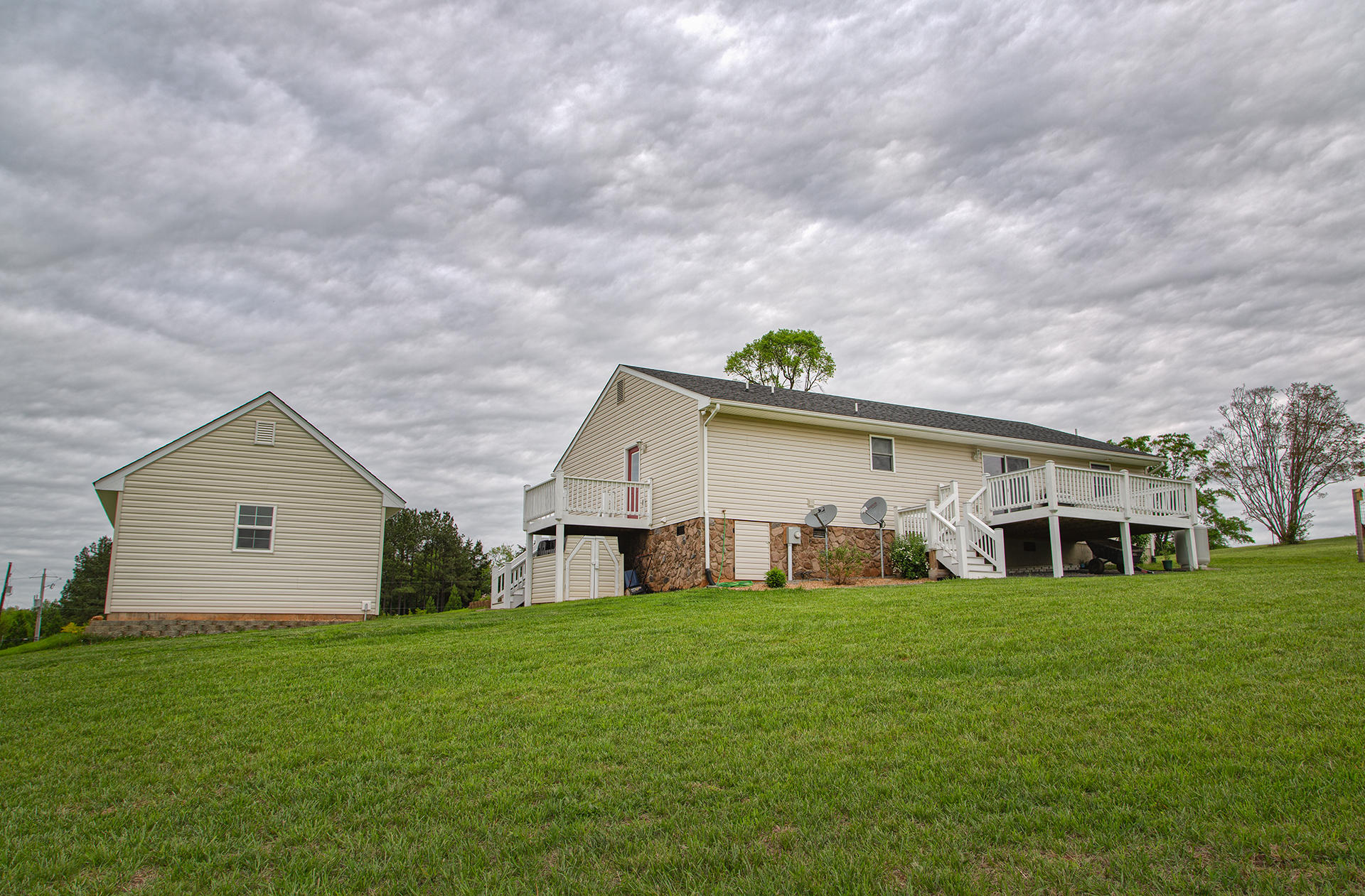 3746 Horseshoe Bend Road Goodview, VA 24095 - Photo 30 of 35 a view of a house with a yard and sitting area