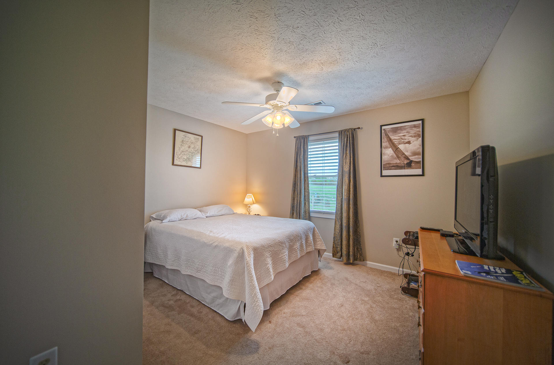3746 Horseshoe Bend Road Goodview, VA 24095 - Photo 4 of 35 a bedroom with a bed and a flat screen tv