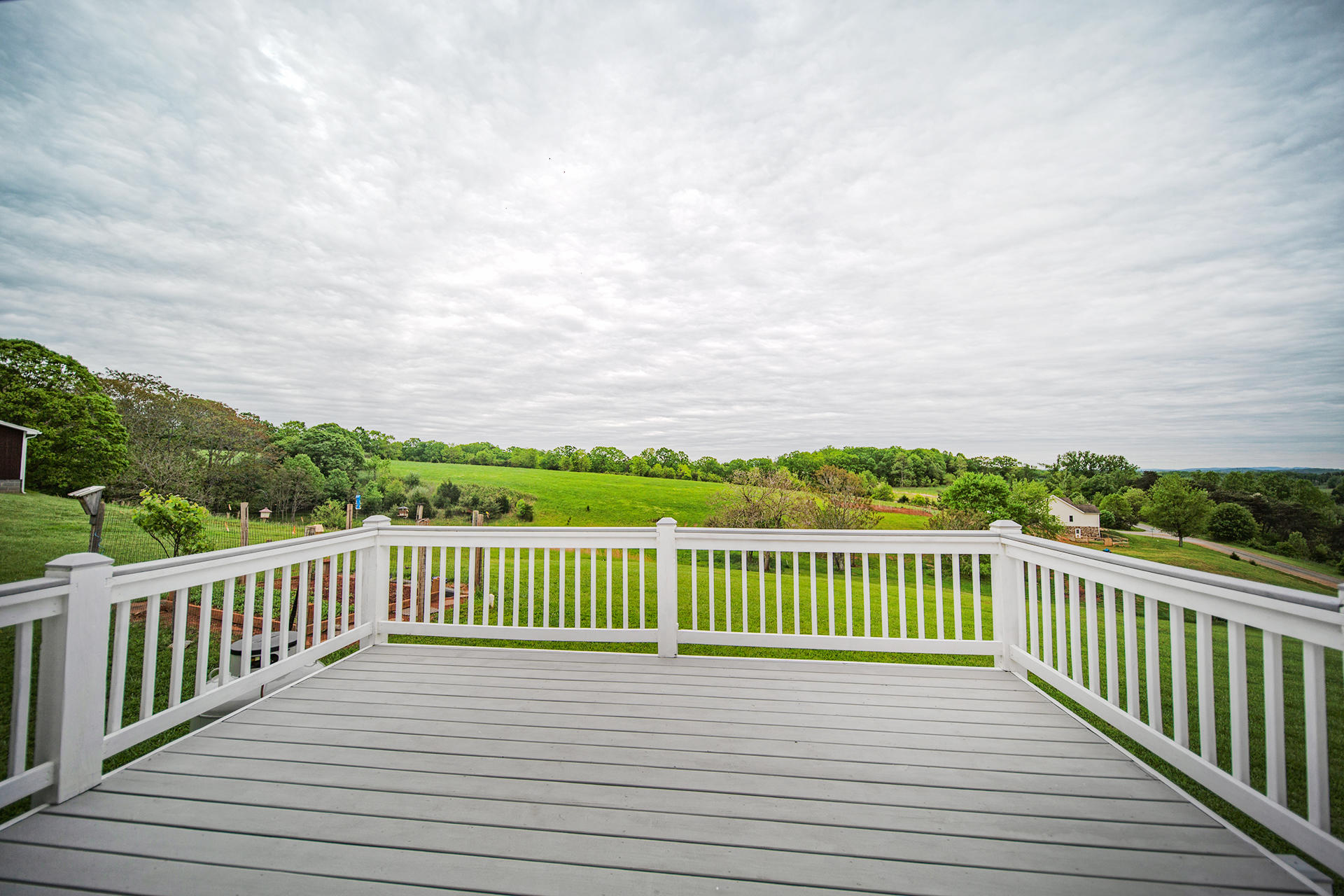 3746 Horseshoe Bend Road Goodview, VA 24095 - Photo 8 of 35 a view of a wooden deck with a yard