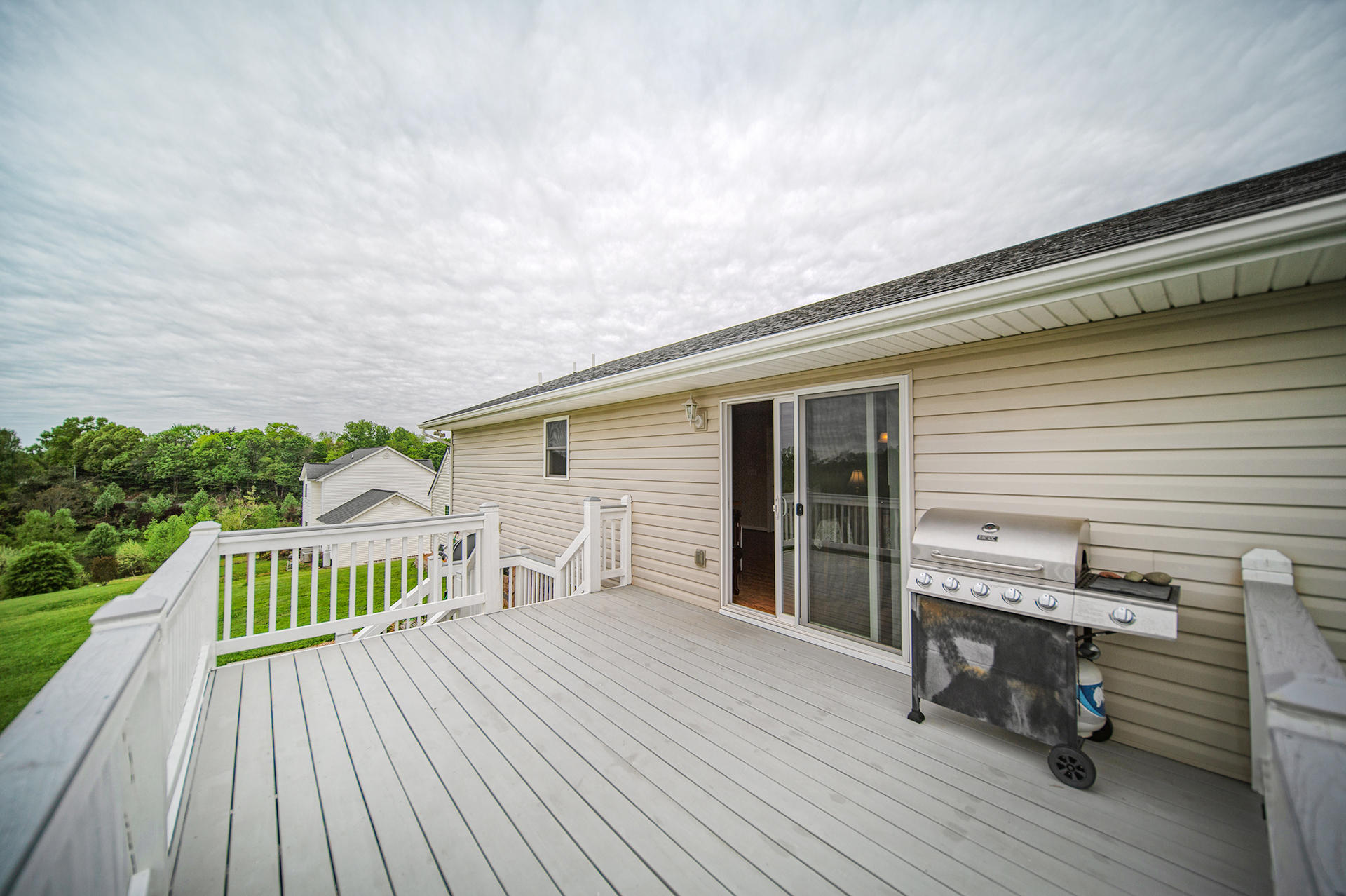 3746 Horseshoe Bend Road Goodview, VA 24095 - Photo 10 of 35 a roof deck with table and chairs and wooden floor