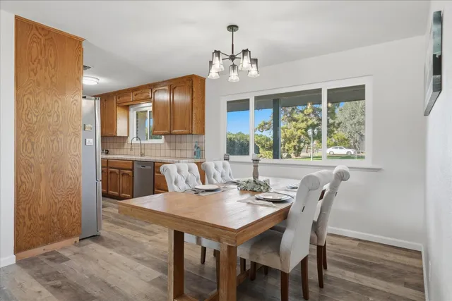 a view of a dining room with furniture window and outside view