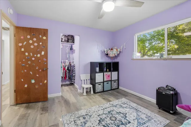 a bed room with a bed and a window